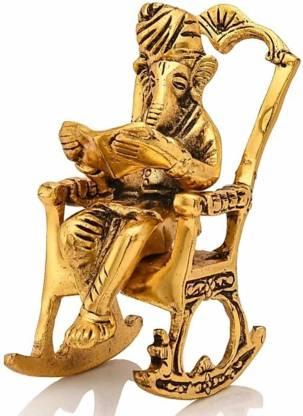 Golden Lord Ganesha Statue Sitting On A Rocking Chair And Reading Ramayan Showpiece