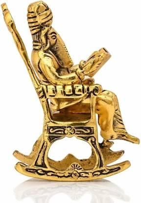 Golden Lord Ganesha Statue Sitting On A Rocking Chair And Reading Ramayan Showpiece
